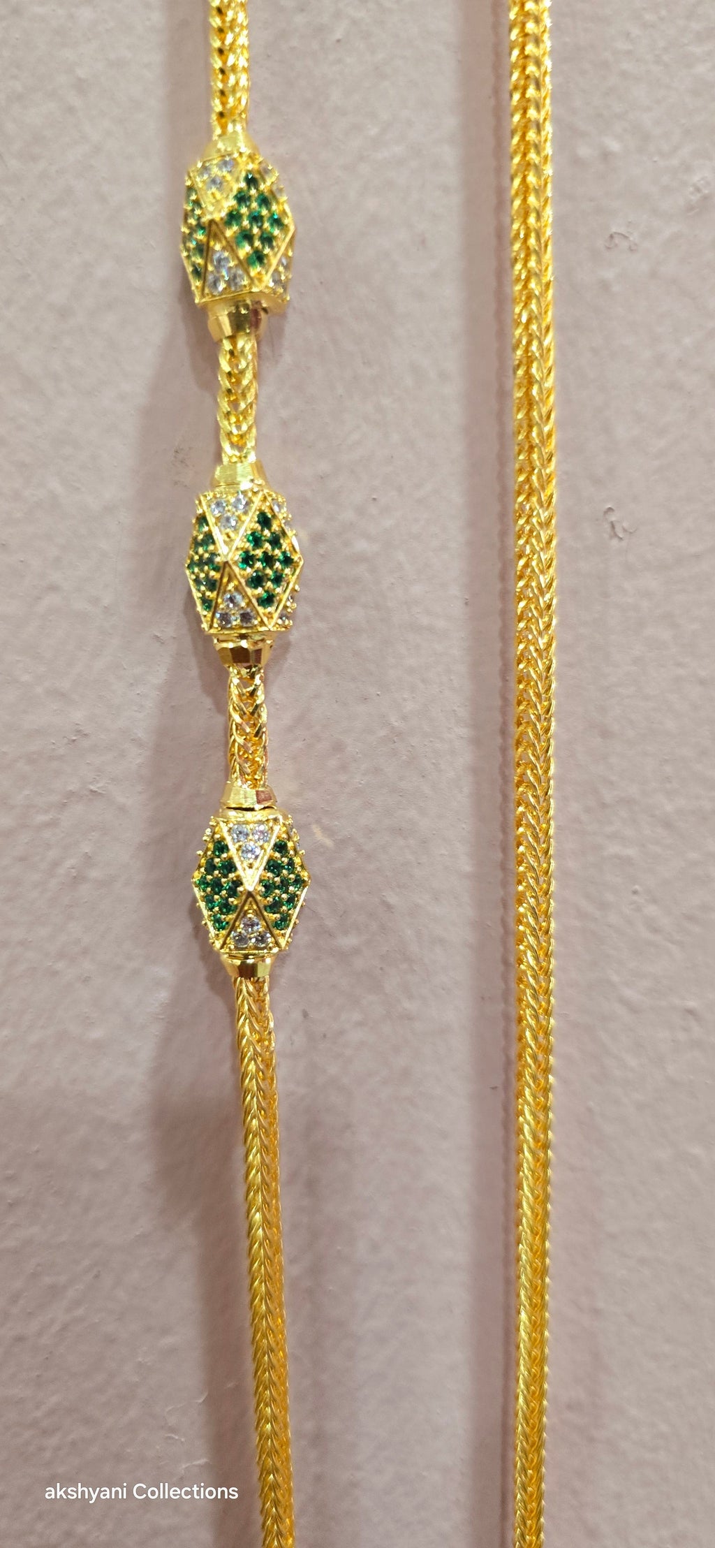 Function wear thalikodi with 3 inches extension. Green octagon shape brooch with mossanite stones embedded with brilliance