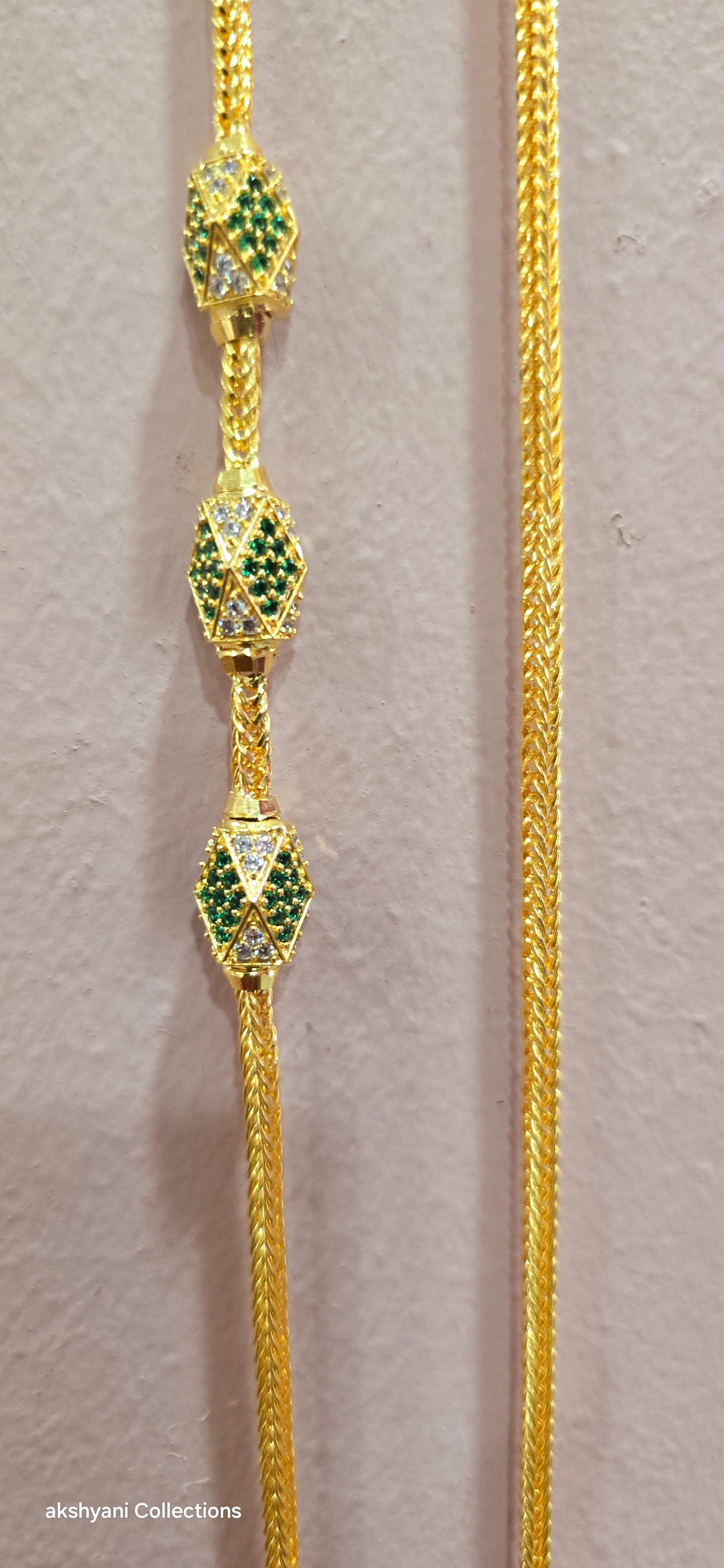 Function wear thalikodi with 3 inches extension. Green octagon shape brooch with mossanite stones embedded with brilliance