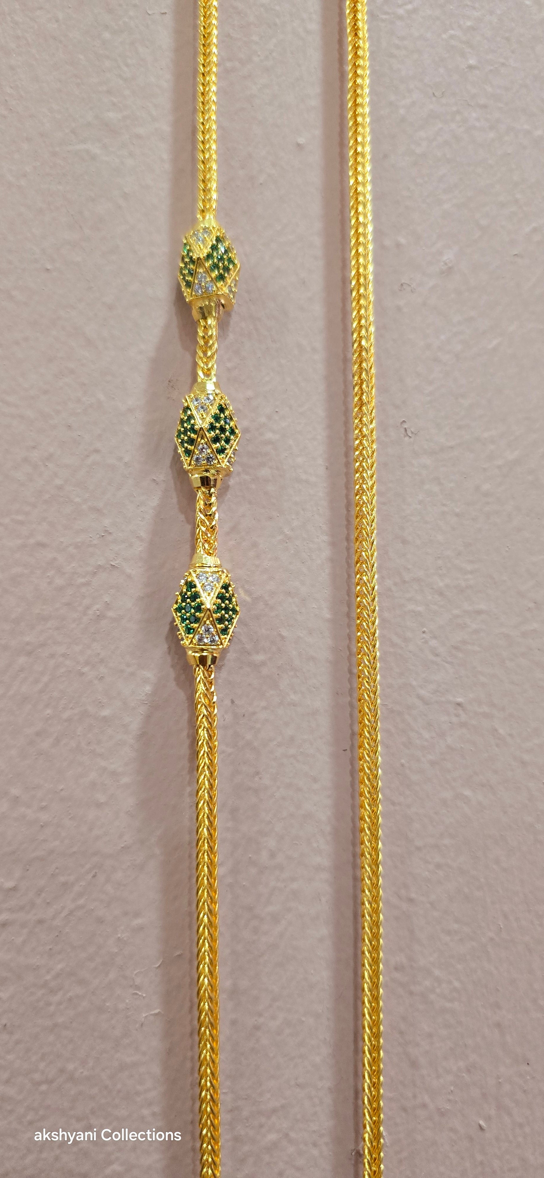 Function wear thalikodi with 3 inches extension. Green octagon shape brooch with mossanite stones embedded with brilliance