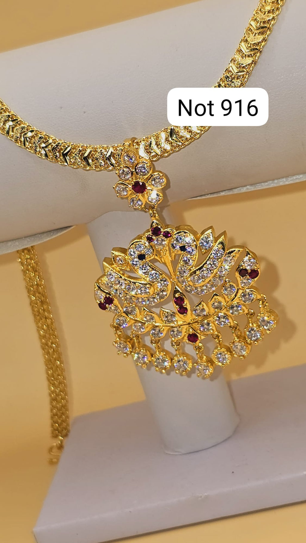 Code 883T. Aatil pendent maroon with Diamontelle cz cut chain.