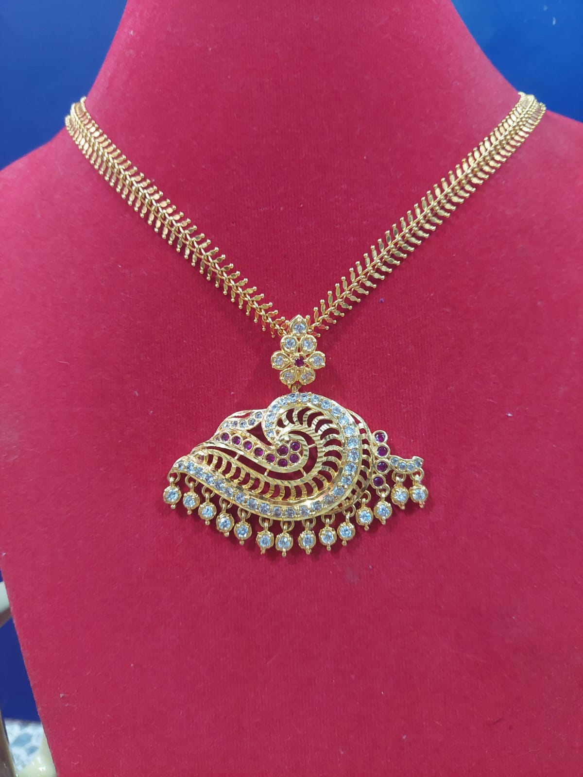 CHAIN WITH PEACOCK LOCKET
